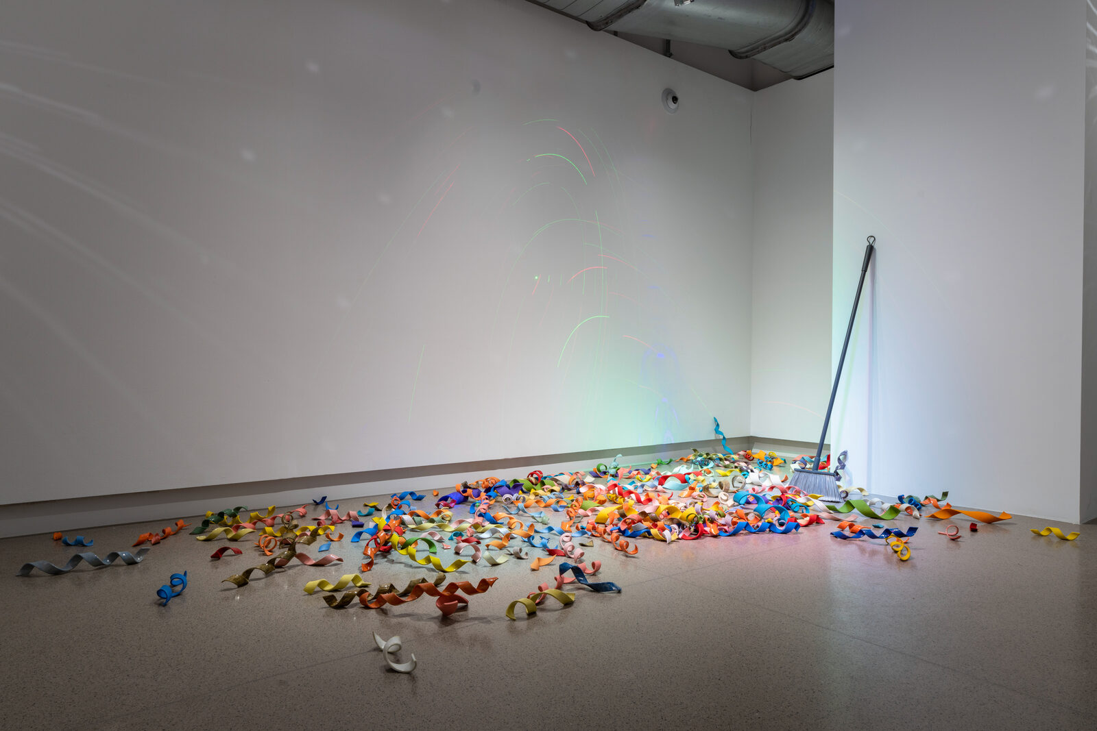 Confetti, hand-built ceramic confetti scattered across the gallery floor