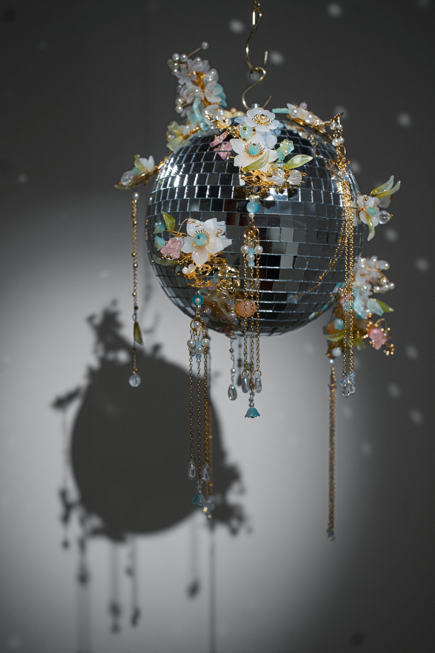 Flower in the Mirror Moon on the Water 镜花水月 #3, Grain Rain 谷雨, a mirror ball adorned with plastic floral beadwork