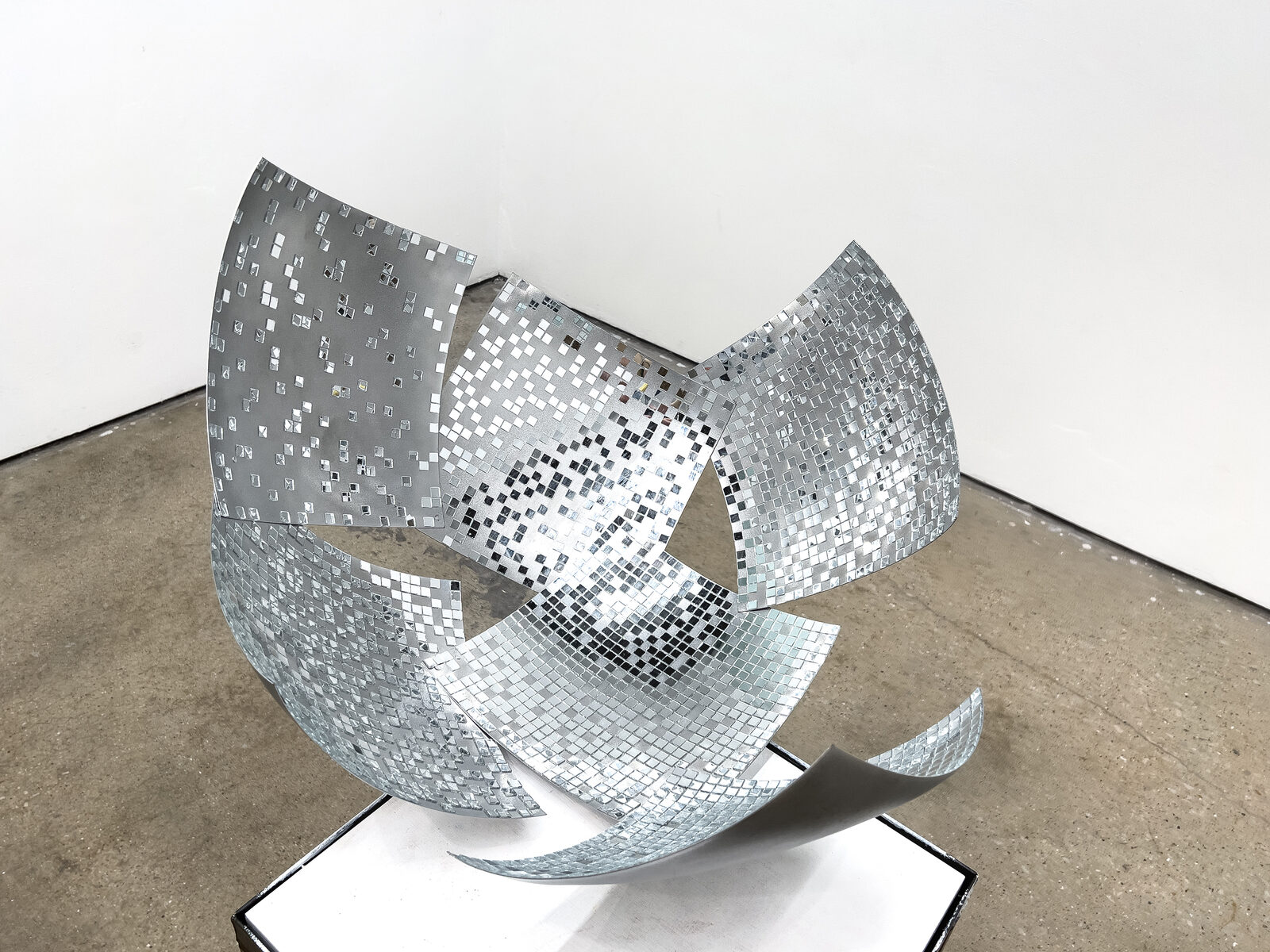 Puzzled Dome, a powder-coated steel and mirror dome paired with shearling fur