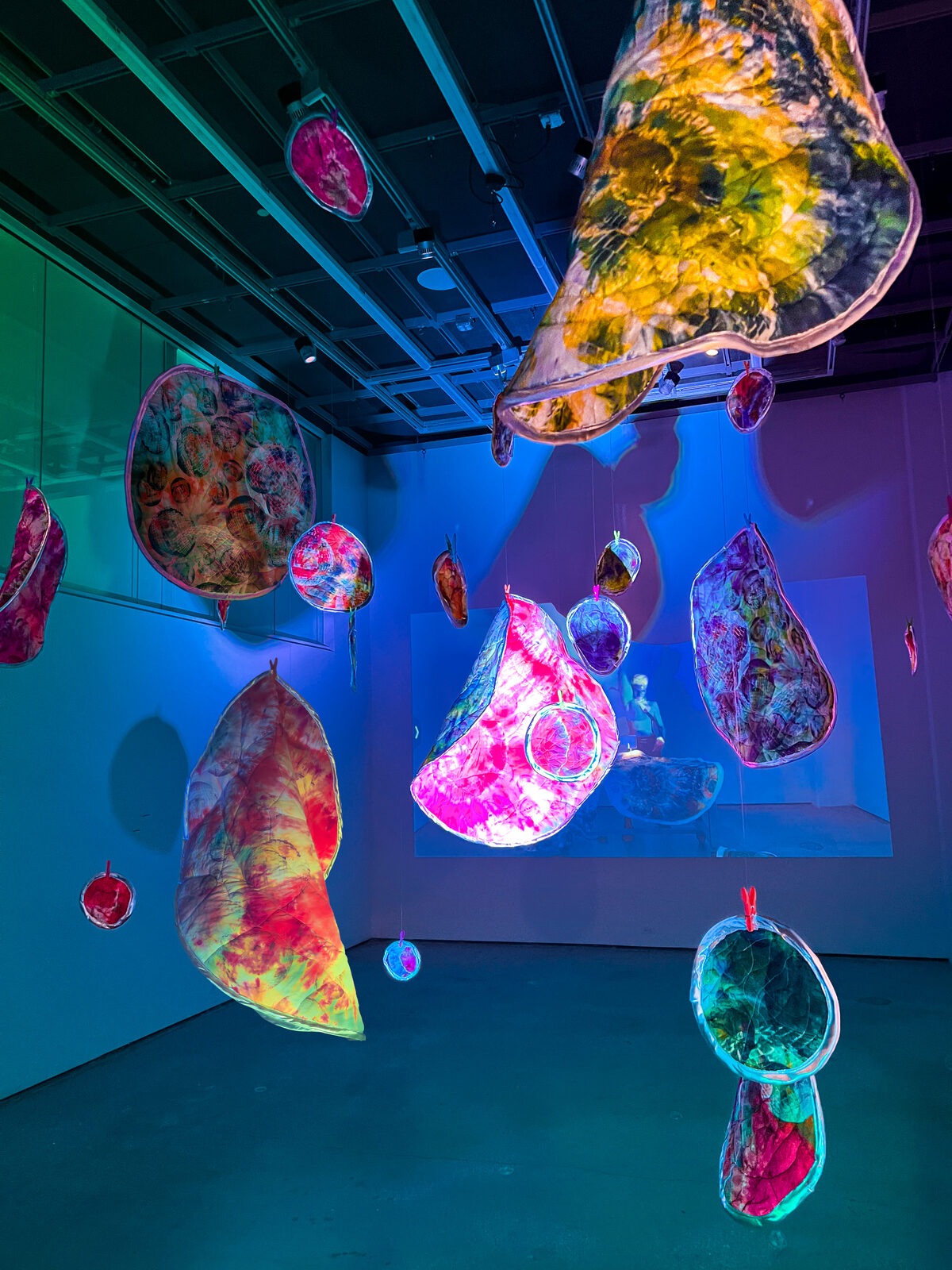 Quilted Emptiness, thirty-five disco-ball quilts hanging from the ceiling by clothespins