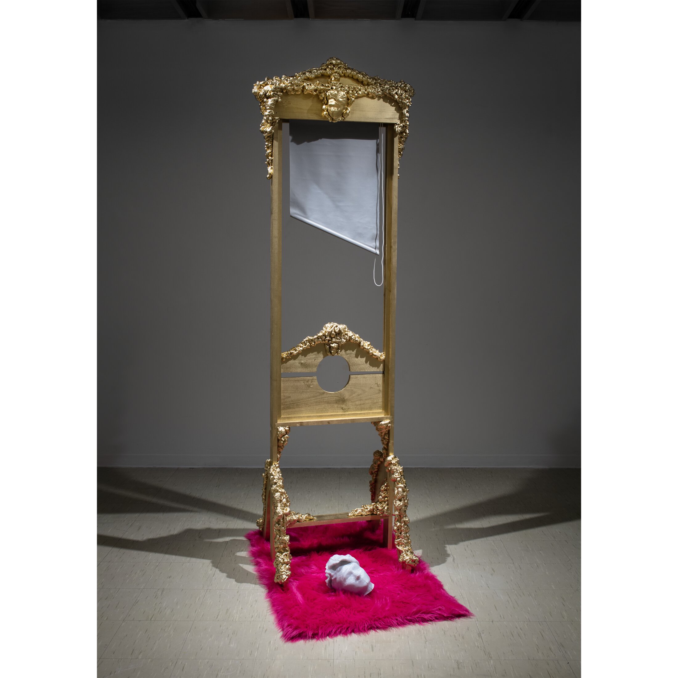 Self-Portrait Blinds to LIVE, a gilded Rococo guillotine sculpture