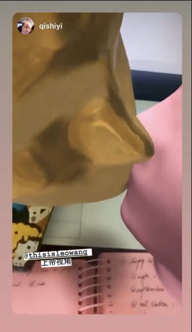 Self-Portrait Soulmate, two AR-filter heads in gold and pink kissing, seen through the Instagram camera