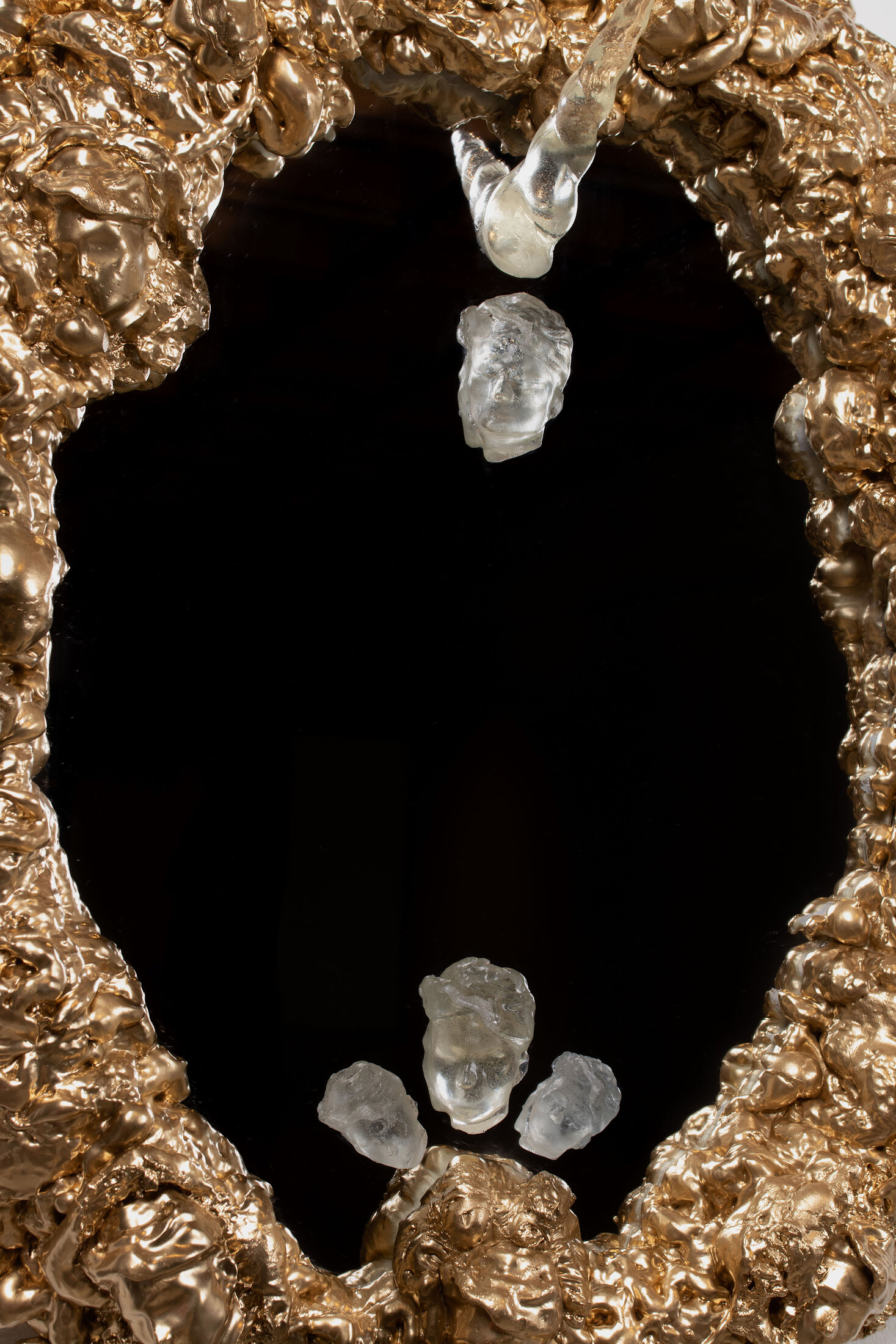 Self-Portrait The Vanity, a gilded Rococo mirror frame studded with resin casts of the artist's head